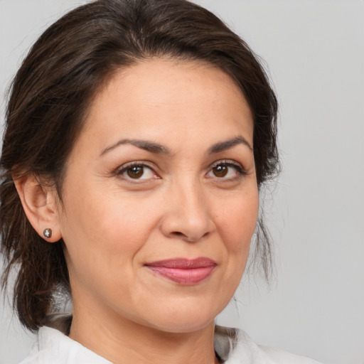Joyful white adult female with medium  brown hair and brown eyes