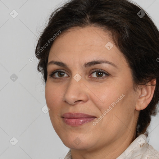 Joyful white adult female with medium  brown hair and brown eyes