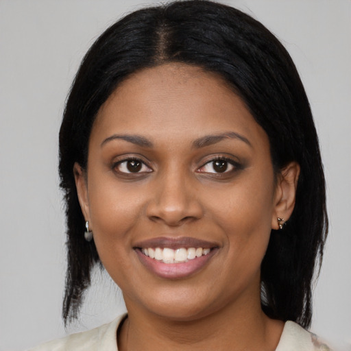 Joyful latino young-adult female with medium  black hair and brown eyes