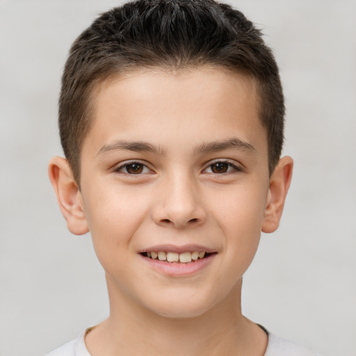 Joyful white child male with short  brown hair and brown eyes