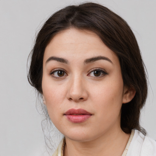 Neutral white young-adult female with medium  brown hair and brown eyes