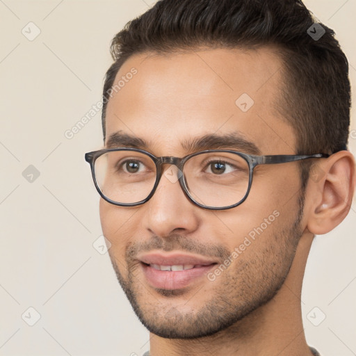 Joyful white young-adult male with short  brown hair and brown eyes