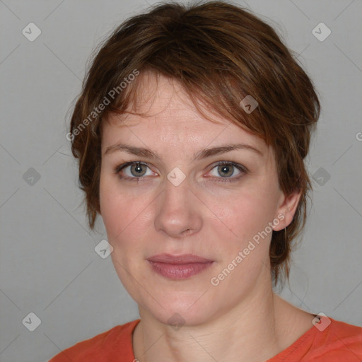 Joyful white adult female with medium  brown hair and blue eyes