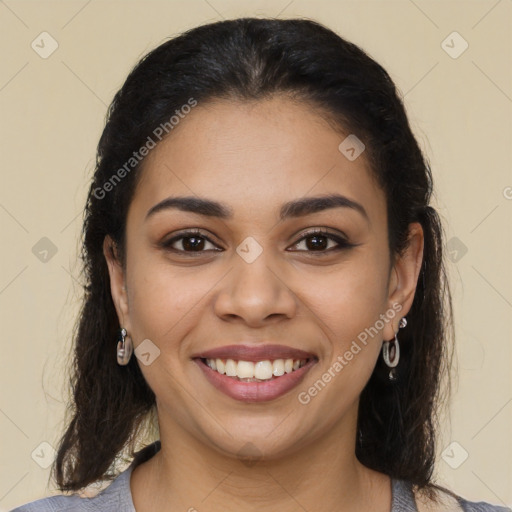 Joyful latino young-adult female with medium  brown hair and brown eyes