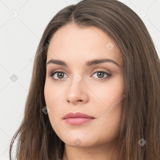 Neutral white young-adult female with long  brown hair and brown eyes