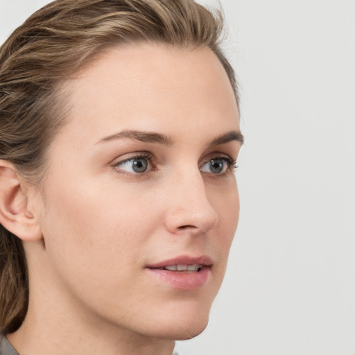 Neutral white young-adult female with medium  brown hair and blue eyes