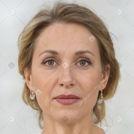 Joyful white adult female with medium  brown hair and grey eyes