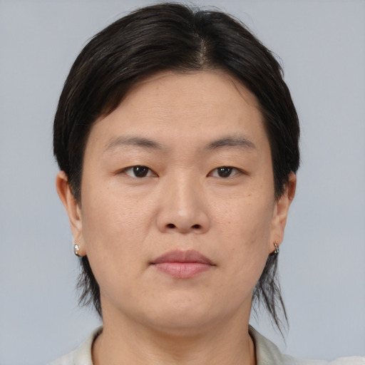 Neutral asian young-adult female with medium  brown hair and brown eyes