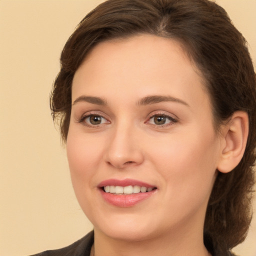 Joyful white young-adult female with medium  brown hair and brown eyes