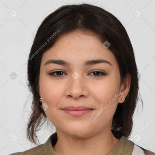 Joyful latino young-adult female with medium  brown hair and brown eyes