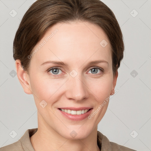 Joyful white young-adult female with short  brown hair and grey eyes