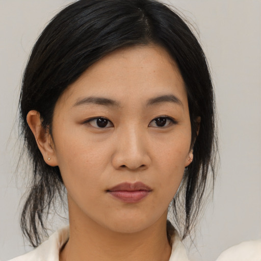 Neutral asian young-adult female with medium  black hair and brown eyes