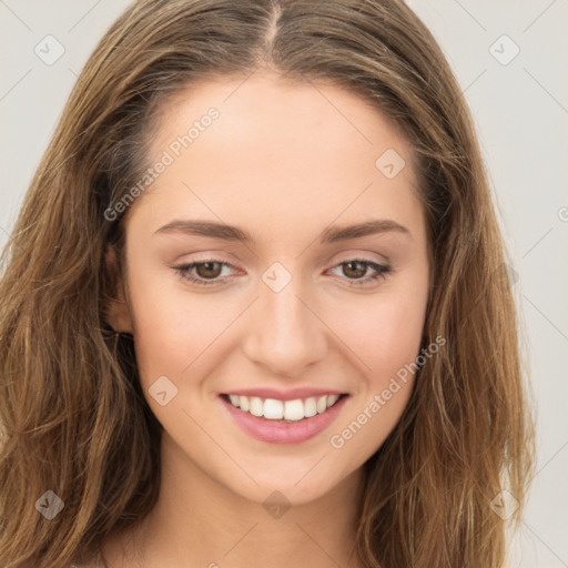 Joyful white young-adult female with long  brown hair and green eyes