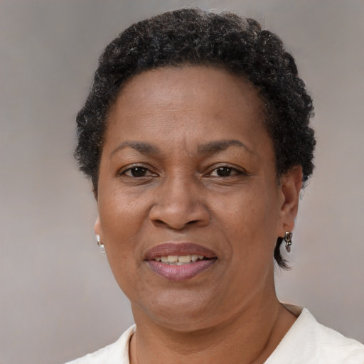 Joyful black adult female with short  brown hair and brown eyes