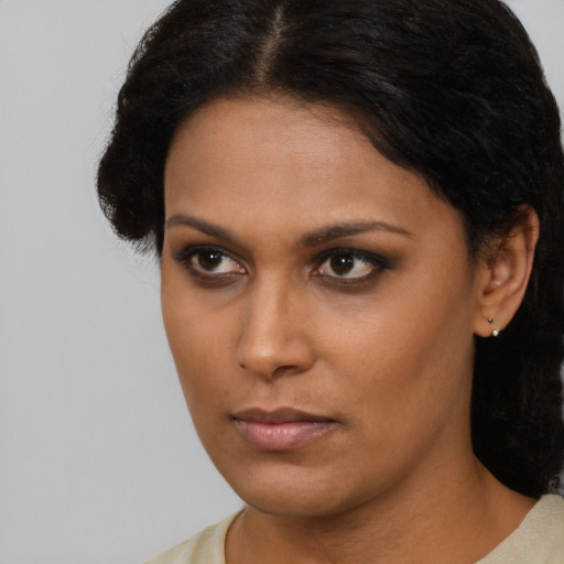 Neutral latino young-adult female with short  brown hair and brown eyes