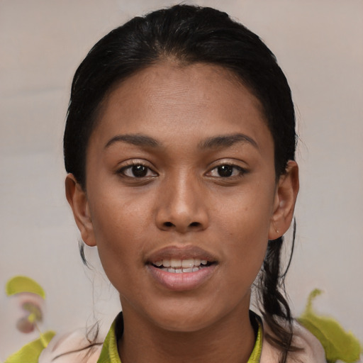 Joyful black young-adult female with medium  black hair and brown eyes