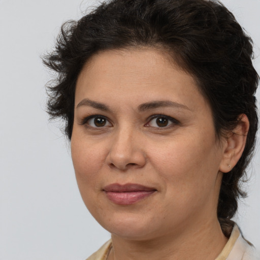 Joyful white adult female with medium  brown hair and brown eyes