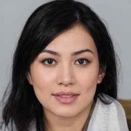 Joyful asian young-adult female with medium  black hair and brown eyes