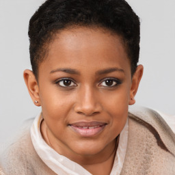 Joyful black young-adult female with short  brown hair and brown eyes