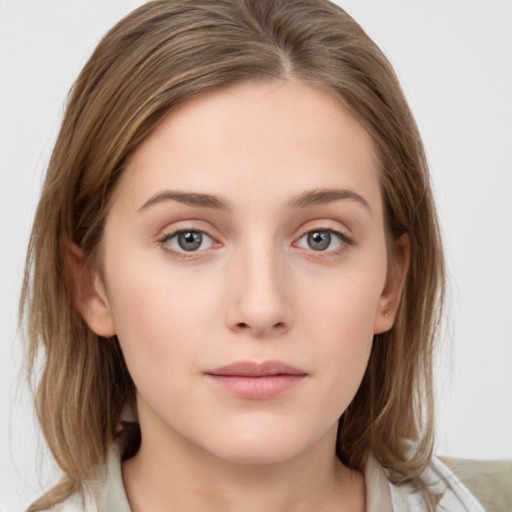 Neutral white young-adult female with medium  brown hair and grey eyes