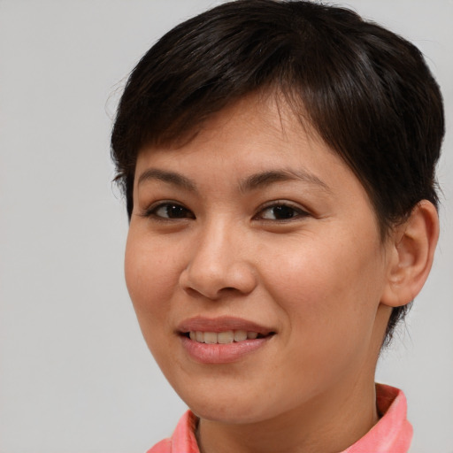Joyful asian young-adult female with short  brown hair and brown eyes