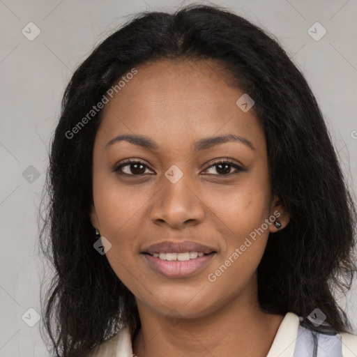 Joyful black young-adult female with long  brown hair and brown eyes