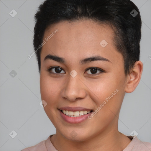 Joyful black young-adult female with short  brown hair and brown eyes