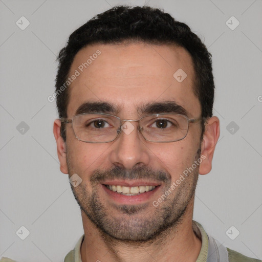Joyful white adult male with short  black hair and brown eyes