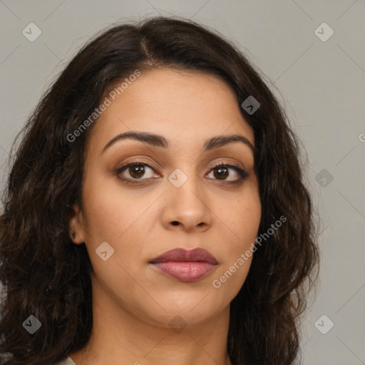 Joyful latino young-adult female with long  brown hair and brown eyes