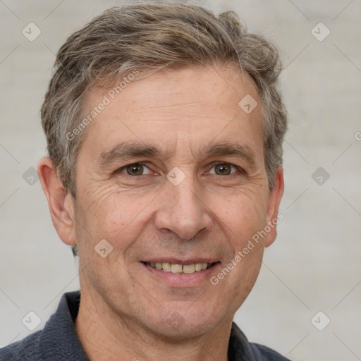 Joyful white adult male with short  brown hair and grey eyes