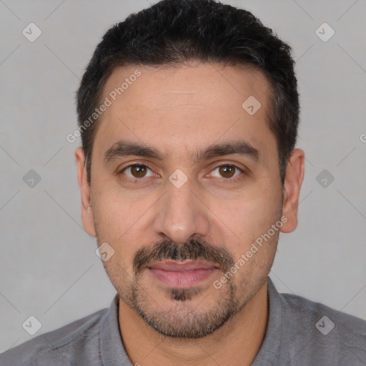 Joyful white young-adult male with short  black hair and brown eyes