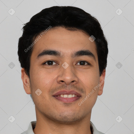 Joyful asian young-adult male with short  black hair and brown eyes