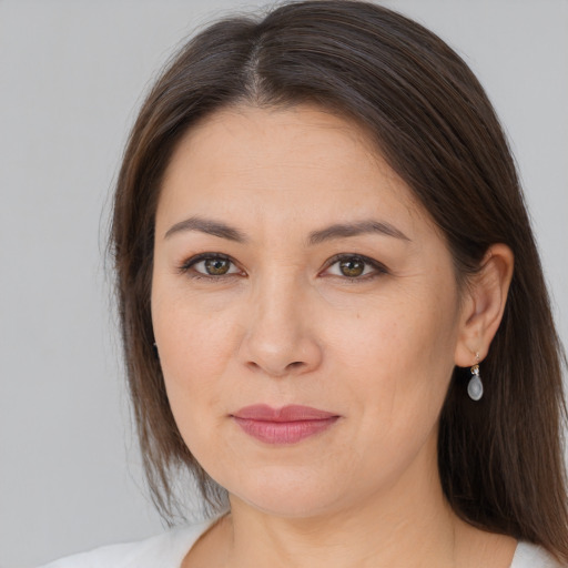 Joyful white adult female with medium  brown hair and brown eyes