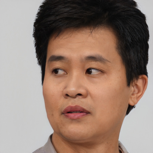 Neutral asian young-adult male with short  black hair and brown eyes