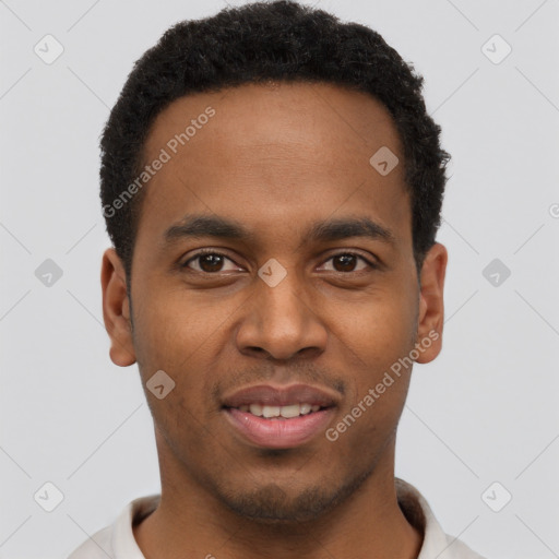 Joyful black young-adult male with short  brown hair and brown eyes