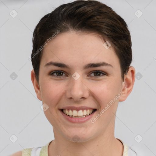 Joyful white young-adult female with short  brown hair and grey eyes