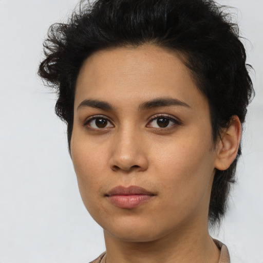 Joyful asian young-adult female with short  brown hair and brown eyes