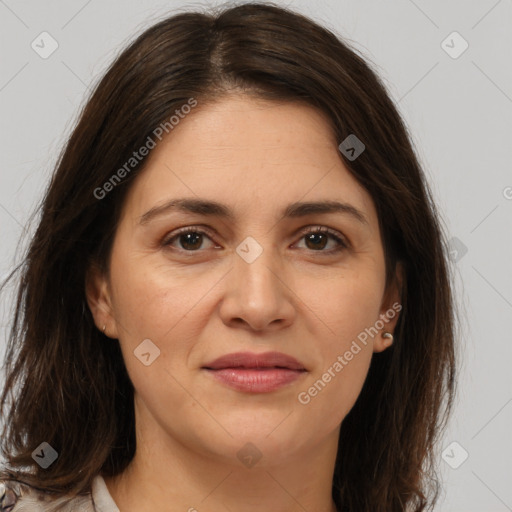 Joyful white adult female with medium  brown hair and brown eyes