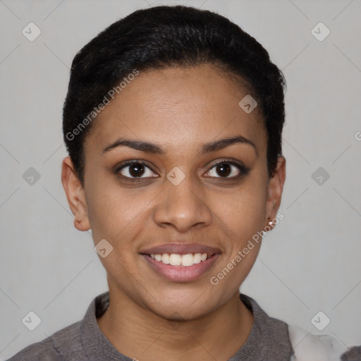 Joyful black young-adult female with short  black hair and brown eyes