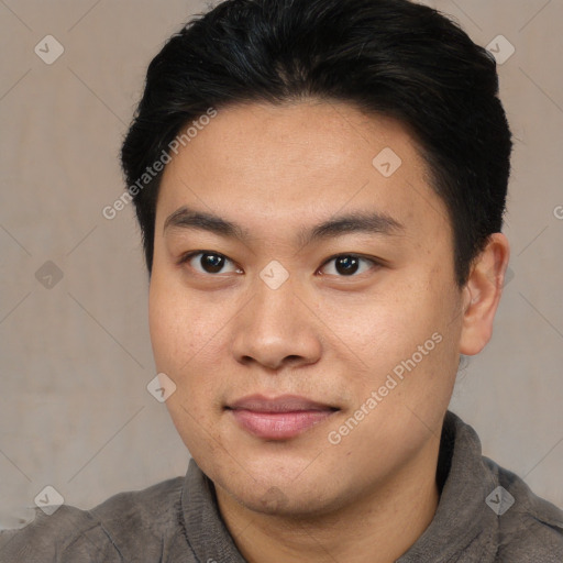 Joyful asian young-adult male with short  black hair and brown eyes