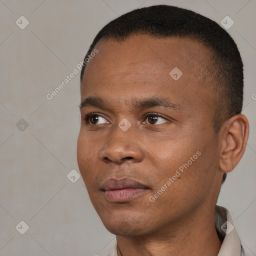 Neutral black young-adult male with short  black hair and brown eyes