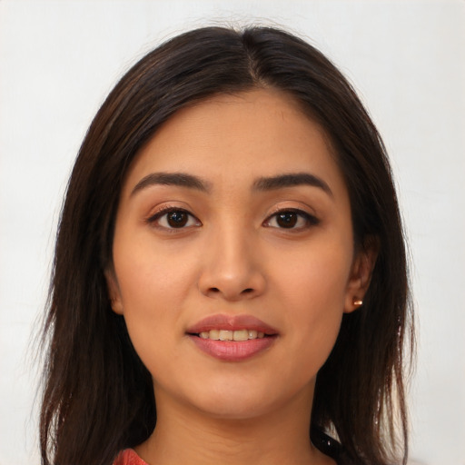 Joyful white young-adult female with long  brown hair and brown eyes