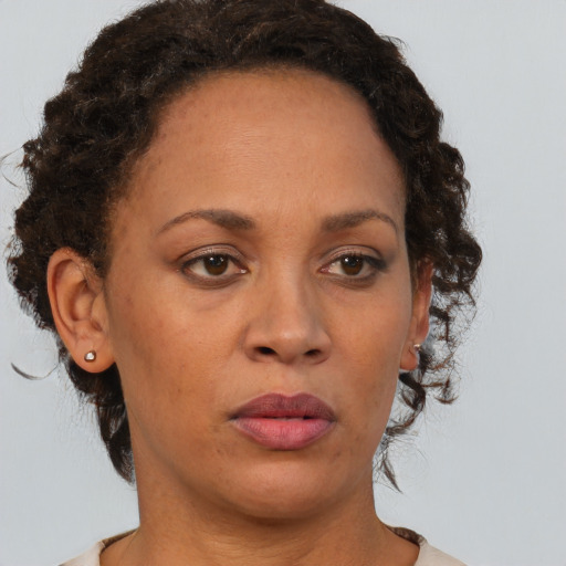 Neutral black adult female with short  brown hair and brown eyes
