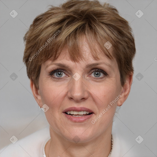 Joyful white adult female with short  brown hair and grey eyes