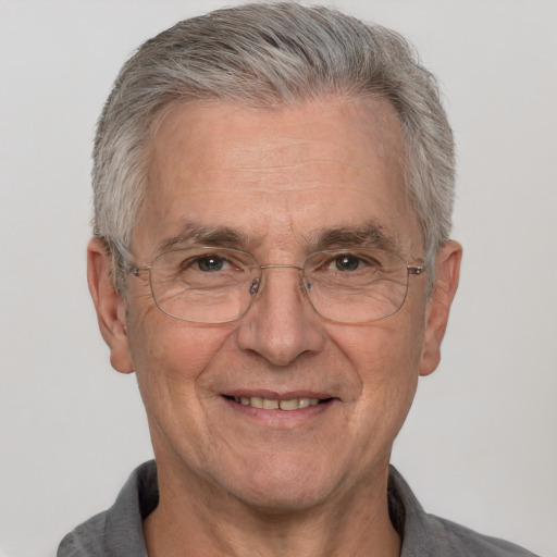 Joyful white middle-aged male with short  gray hair and brown eyes