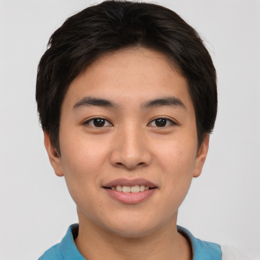 Joyful asian young-adult male with short  brown hair and brown eyes