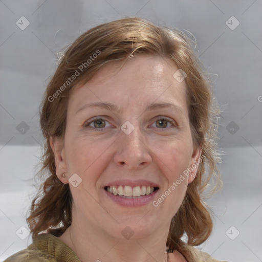 Joyful white adult female with medium  brown hair and grey eyes