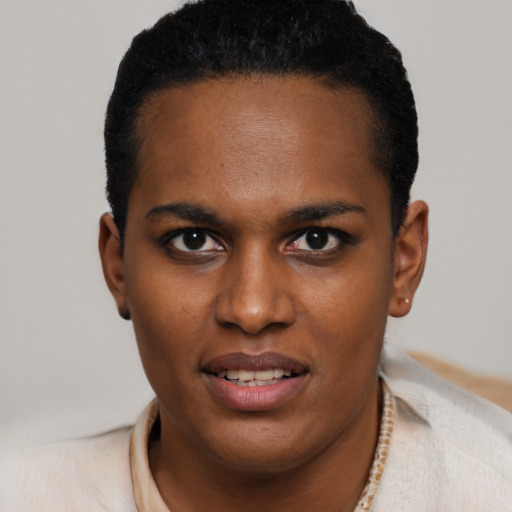 Joyful black young-adult female with short  brown hair and brown eyes