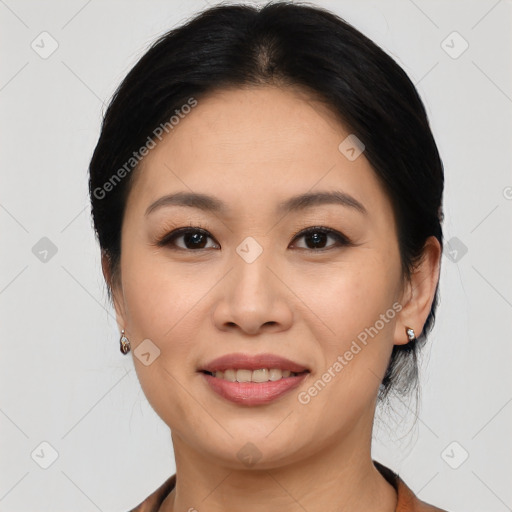 Joyful asian young-adult female with medium  brown hair and brown eyes