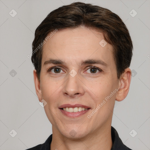 Joyful white adult male with short  brown hair and brown eyes